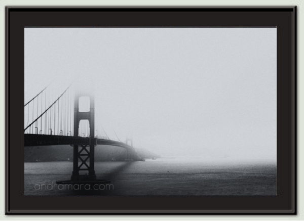 Golden Gate bridge piercing through the fog